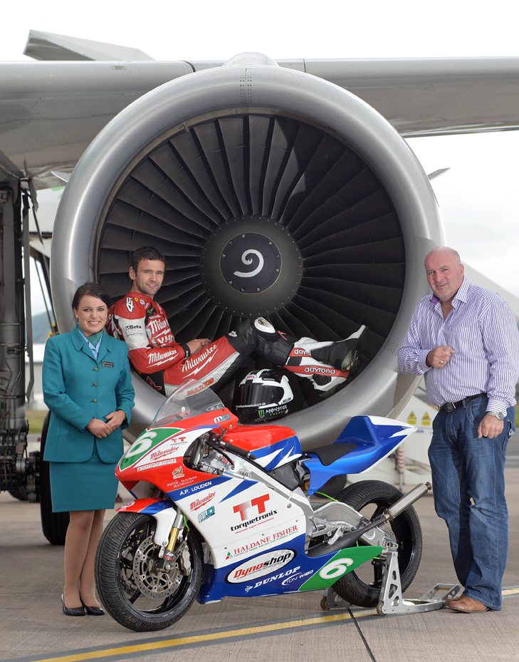 The sky’s the limit: Road racing ace William Dunlop helps launch Aer Lingus as official co-sponsor for the 2013 Metzeler Ulster Grand Prix for the fifth year running. Aer Lingus has three return flights daily to both Heathrow and Gatwick with 84 weekly departures and arrivals amounting to over 12,000 seats each week; giving international fans travelling into Northern Ireland for Bike Week a wide range of options. For more information on fares please visit www.aerlingus.com Pictured L-R: Regan Madden from Aer Lingus; William Dunlop and Noel Johnston; Clerk of the Course at the Ulster Grand Prix.