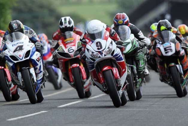 PACEMAKER, BELFAST, 17/8/2013: Guy Martin (Tyco Suzuki) and Michael Dunlop ( Honda TT Legends) lead the Superbike race pack off the line at the Metzeler Ulster Grand Prix today. PICTURE BY STEPHEN DAVISON