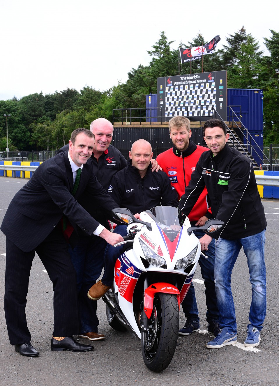 ENVIRONMENT Minister Mark H Durkan has joined the Dundrod and District Motorcycle Club to appeal to motorcyclists to take care on the roads on the eve of the Ulster Grand Prix. Mr Durkan urged biking enthusiasts attending or watching the race to leave the high speeds to the professionals. Pictured on the grid at the famous Dundrod circuit is Environment Minister Mark H Durkan, Clerk of the Course at the Metzeler Ulster Grand Prix Noel Johnston and racers Keith Amor, Ian Hutchinson and Glenn Irwin.